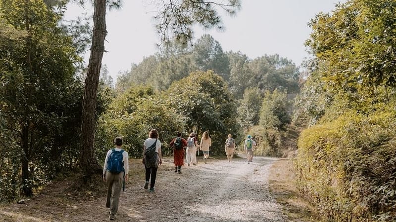 Yoga hiking retreat in Nepal with guests walking in nature at Niru Yoga Homestay