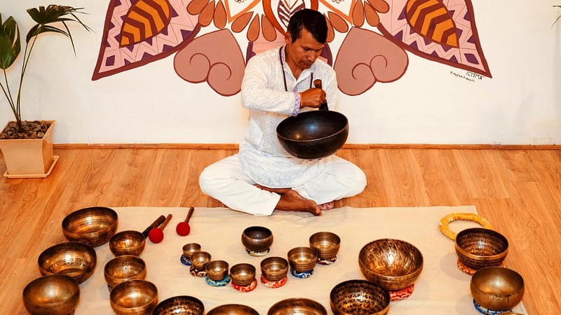 Sound healing bowls session during yoga retreat in Nepal