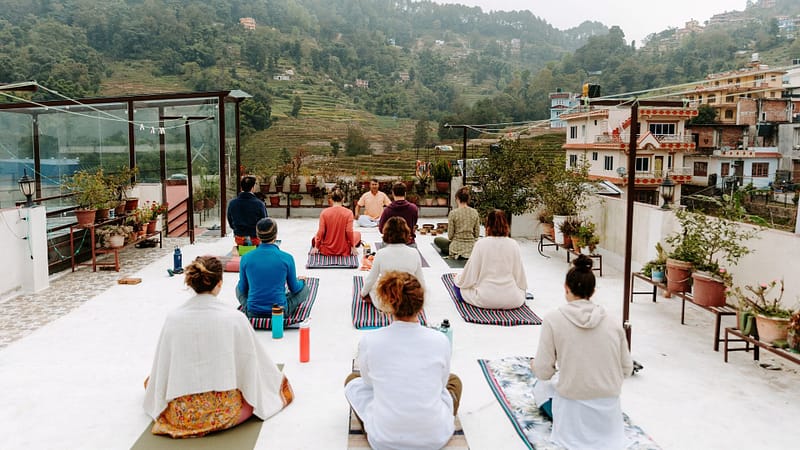 Morning rooftop yoga session at Niru Yoga Homestay in Kathmandu Valley, Nepal